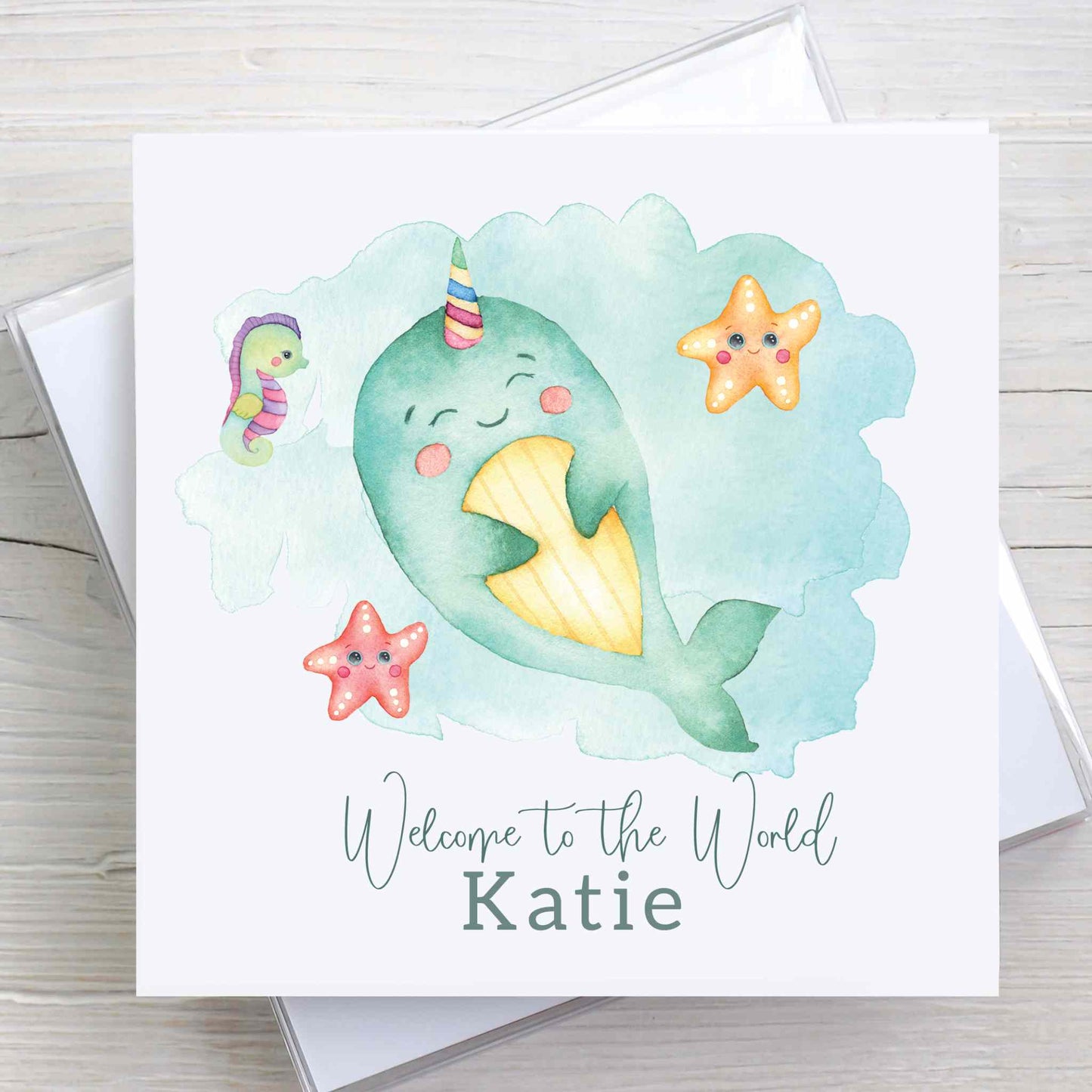 New baby, gender neutral, Welcome to the World card featuring baby narwhal, under the sea design. Baby name is printed on front of card.