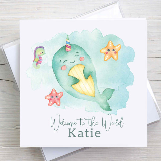 New baby, gender neutral, Welcome to the World card featuring baby narwhal, under the sea design.  Baby name is printed on front of card.